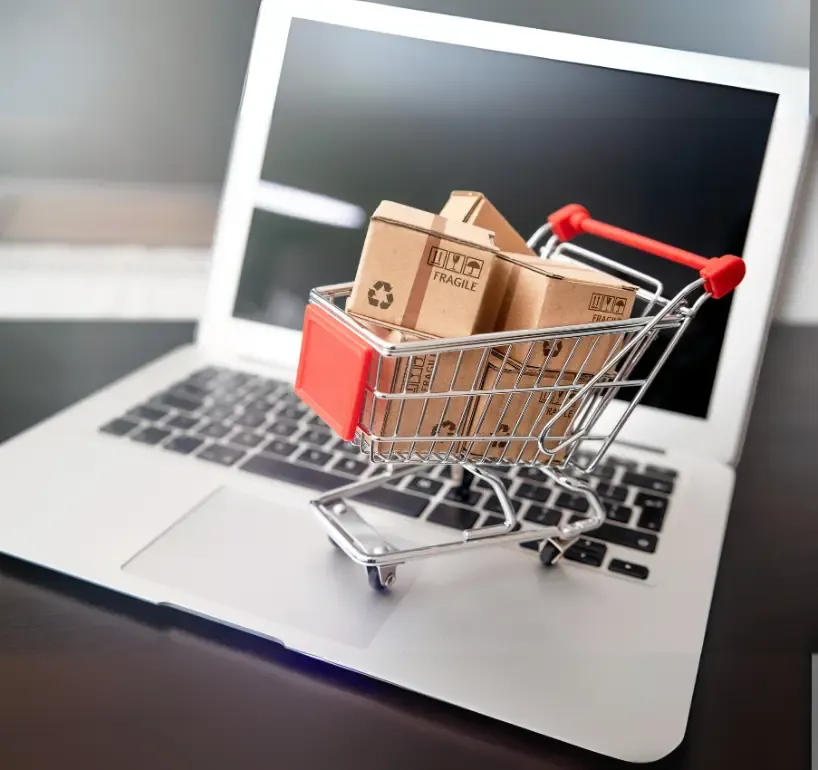 e commerce cart toy on laptop